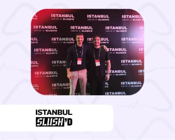Two members of the Dr.Medkit team in front of the Istanbul Slush’d photo wall